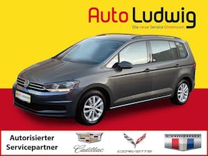 VW Touran Comfortline 2,0 BMT TDI DSG *NAVI *PDC *SHZ *TEMPOMAT bei AutoLudwig GMBH in 3x in 1230 Wien | US-Neuwagen (CADILLAC, CORVETTE, CHEVROLET, DODGE, RAM) | Multimarken Gebrauchtwagenhandel | KFZ Werkstatt mit Bosch Service